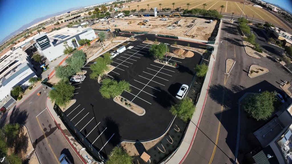 Aerial of completed asphalt parking lot and site paving