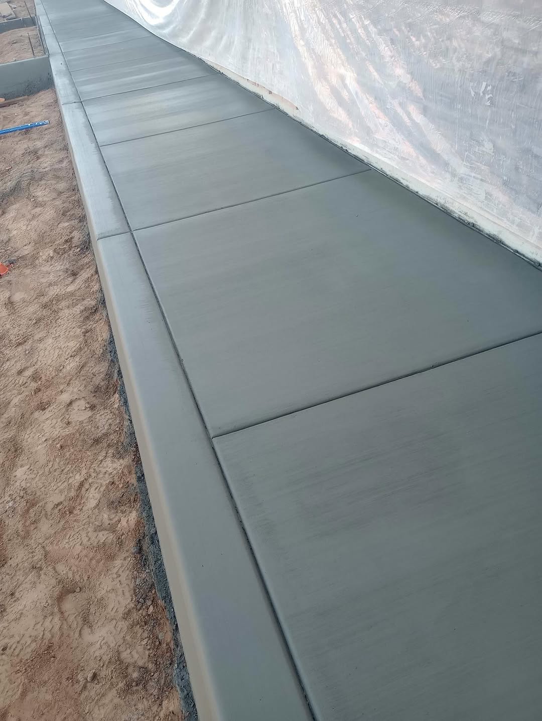 Broom-finished concrete sidewalk panels with clean control joints